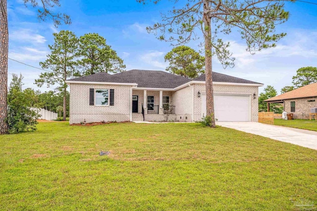 1192 Adrian Way, Milton, FL 32583 - ranch-style house with an attached garage, driveway, brick siding, and a front lawn