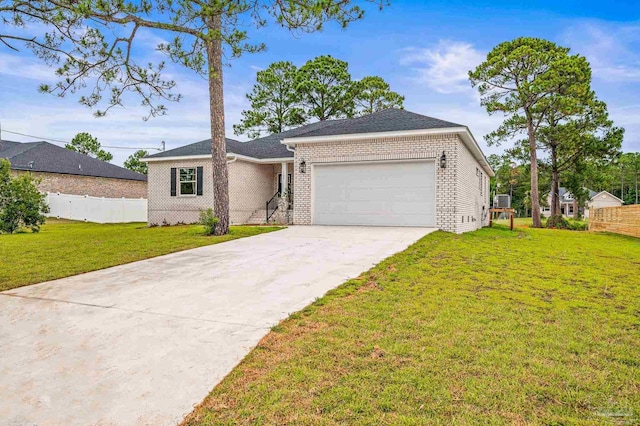 1192 Adrian Way, Milton, FL 32583 - ranch-style home with brick siding, a garage, and concrete driveway