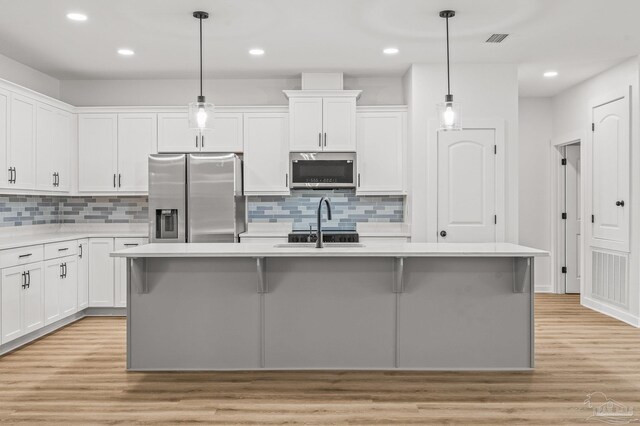 1192 Adrian Way, Milton, FL 32583 - kitchen featuring appliances with stainless steel finishes, light countertops, decorative backsplash, and recessed lighting