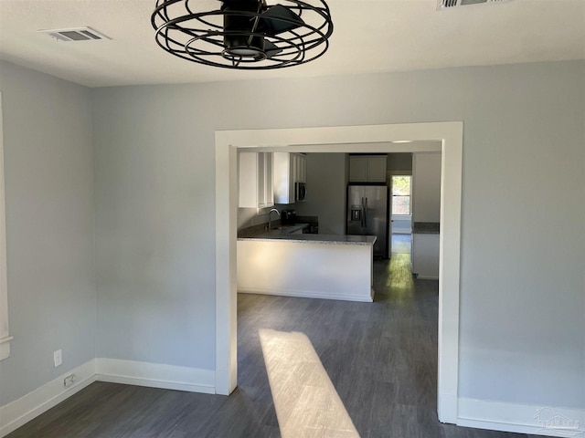 interior space featuring dark wood-type flooring and sink