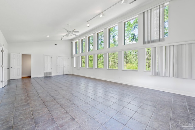 interior space featuring tile patterned flooring, track lighting, high vaulted ceiling, and ceiling fan