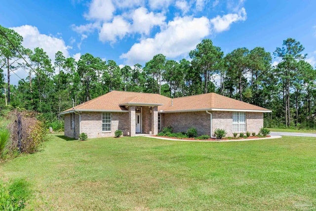 ranch-style home with a front lawn