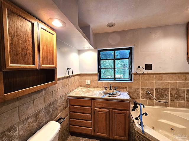 bathroom with a tub to relax in, tile walls, and vanity