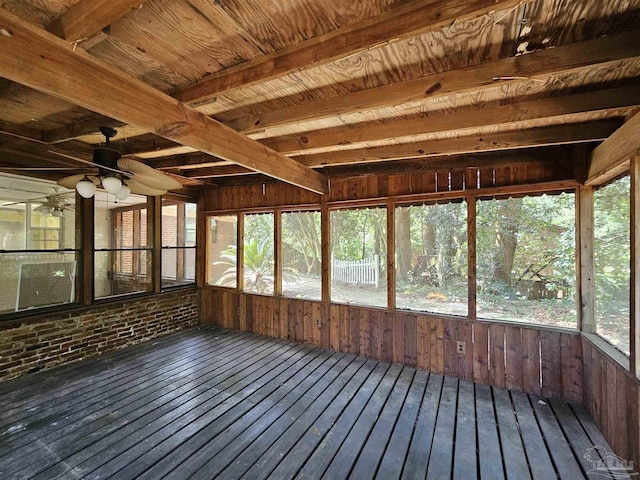 unfurnished sunroom with ceiling fan