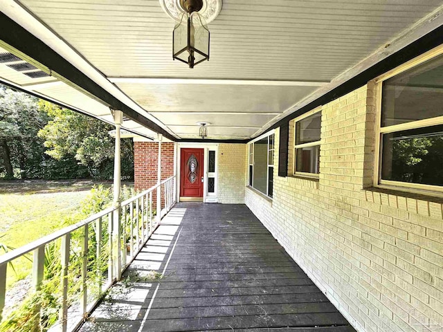 wooden terrace featuring a porch