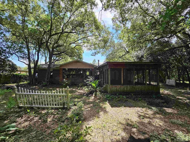 view of yard featuring a sunroom