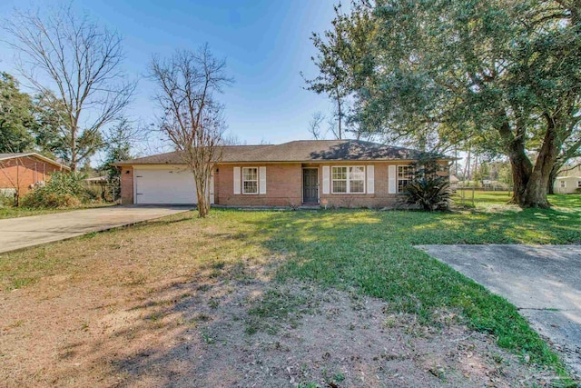 ranch-style home featuring a front yard, concrete driveway, brick siding, and an attached garage