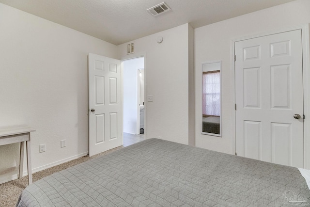 bedroom with carpet and visible vents