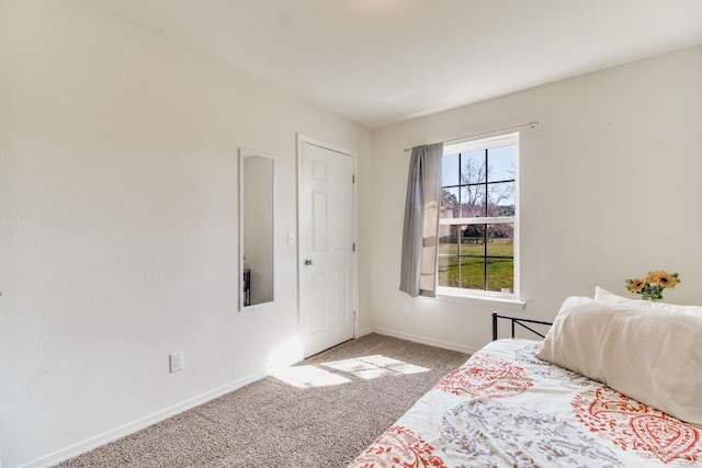 unfurnished bedroom with carpet and baseboards