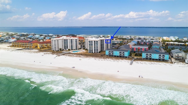 bird's eye view featuring a view of the beach and a water view