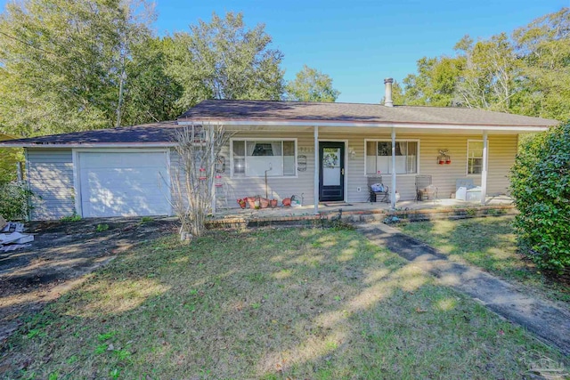 single story home with a porch, a front yard, and a garage