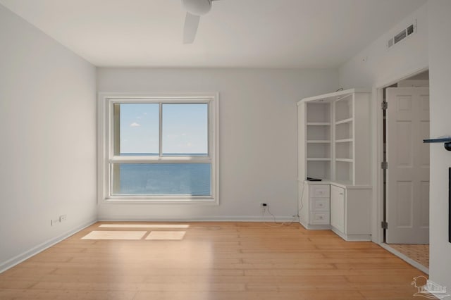 unfurnished bedroom featuring light hardwood / wood-style flooring and ceiling fan