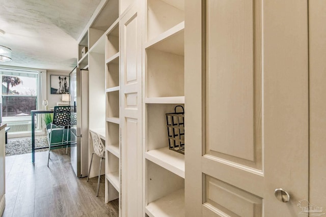 224 E Garden St Unit 236, Pensacola, FL 32502 - spacious closet with light hardwood / wood-style floors