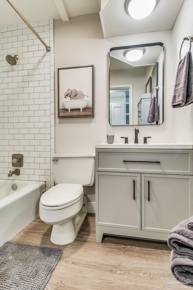 224 E Garden St Unit 236, Pensacola, FL 32502 - full bathroom featuring tiled shower / bath, vanity, toilet, and hardwood / wood-style floors
