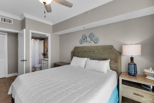 tiled bedroom featuring ensuite bathroom, crown molding, and ceiling fan