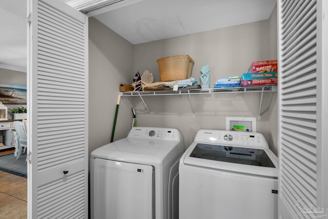 laundry area featuring tile patterned floors and independent washer and dryer