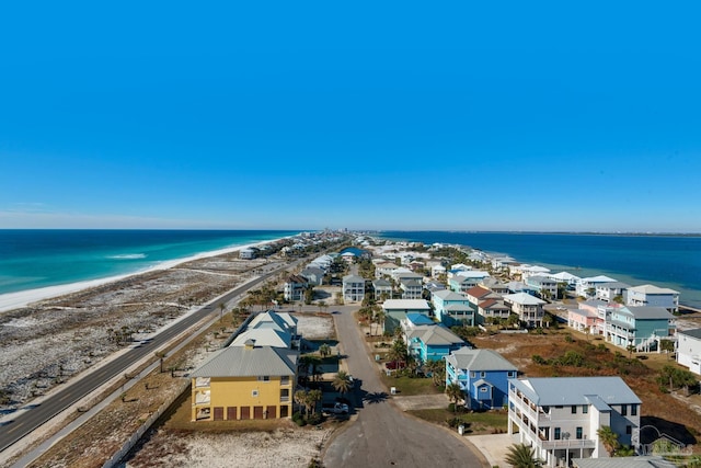 drone / aerial view with a view of the beach and a water view