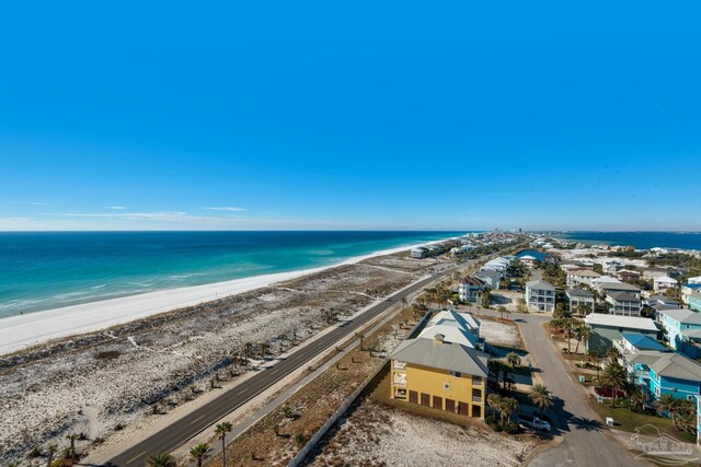 aerial view with a water view and a view of the beach