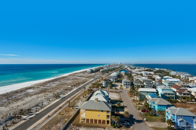 birds eye view of property featuring a view of the beach and a water view