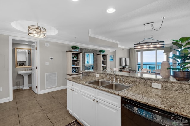 kitchen featuring white cabinetry, dishwasher, sink, hanging light fixtures, and a raised ceiling