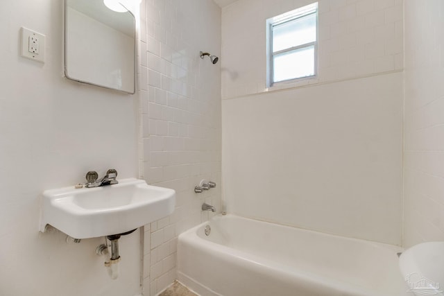 bathroom featuring toilet and tub / shower combination