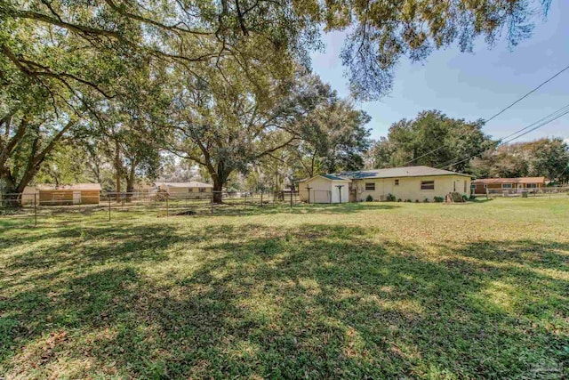 view of yard featuring fence