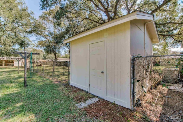 view of shed with fence