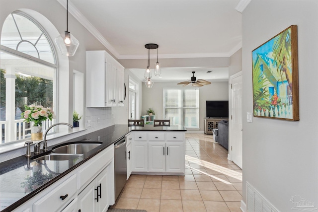 kitchen featuring white cabinetry, dishwasher, sink, kitchen peninsula, and light tile patterned floors