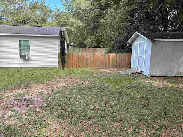 view of yard featuring cooling unit and a shed