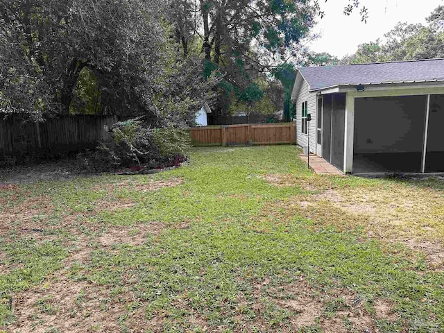 view of yard featuring a sunroom