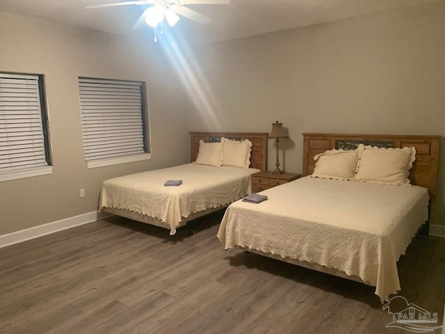 154 Ethel Wingate Dr Unit 210, Pensacola, FL 32507 - bedroom featuring wood finished floors, baseboards, and ceiling fan