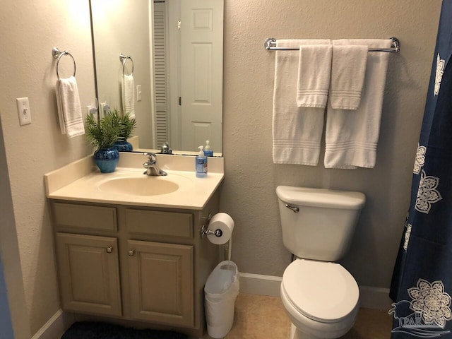 154 Ethel Wingate Dr Unit 210, Pensacola, FL 32507 - bathroom featuring toilet, vanity, baseboards, and tile patterned floors