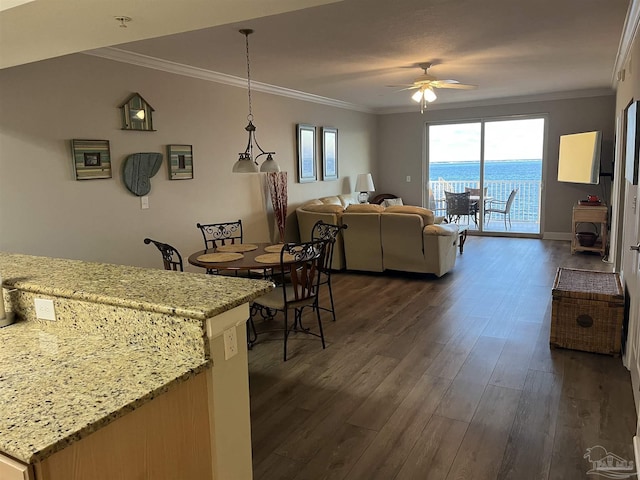 154 Ethel Wingate Dr Unit 210, Pensacola, FL 32507 - dining area with a ceiling fan, dark wood-style floors, crown molding, a wood stove, and baseboards