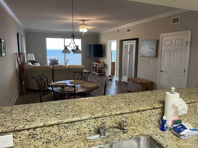 154 Ethel Wingate Dr Unit 210, Pensacola, FL 32507 - dining space with wood finished floors, crown molding, plenty of natural light, a ceiling fan, and baseboards