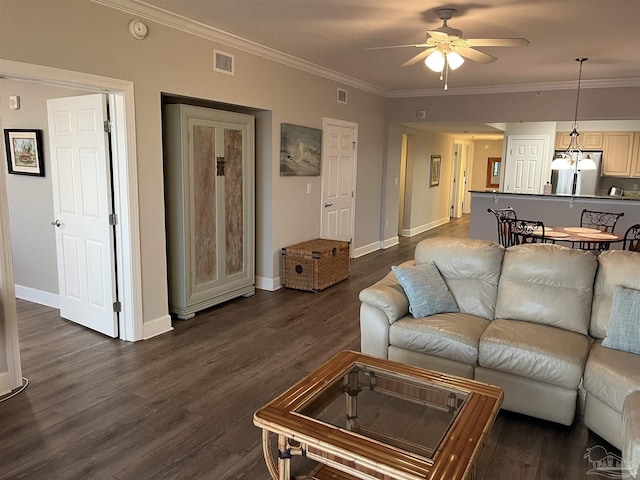 154 Ethel Wingate Dr Unit 210, Pensacola, FL 32507 - living area with a ceiling fan, crown molding, baseboards, and dark wood-style floors