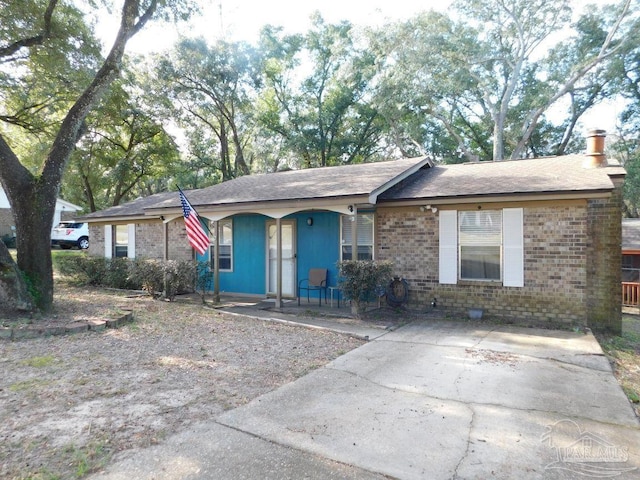 ranch-style house featuring covered porch