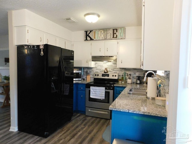 kitchen with appliances with stainless steel finishes, blue cabinets, dark wood-type flooring, sink, and white cabinetry