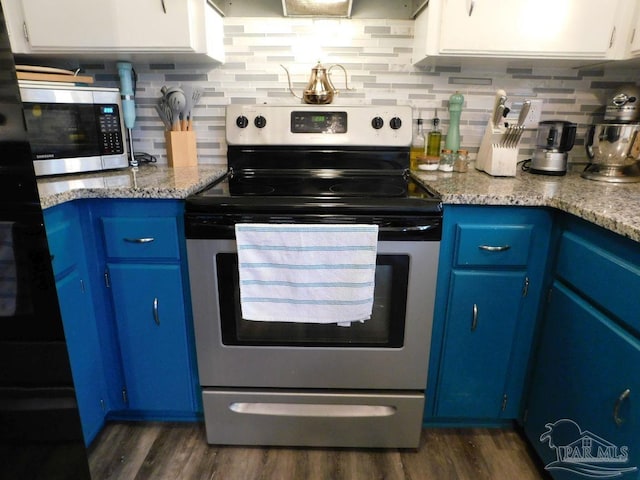 kitchen featuring dark wood-type flooring, tasteful backsplash, blue cabinets, white cabinets, and appliances with stainless steel finishes