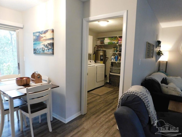 dining area featuring independent washer and dryer and dark wood-type flooring