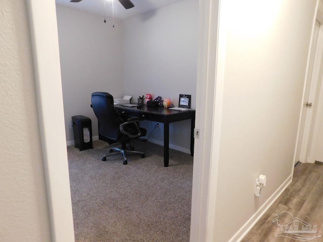 office with light hardwood / wood-style floors and ceiling fan