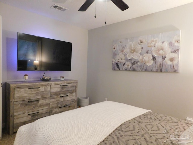 bedroom with ceiling fan and carpet floors