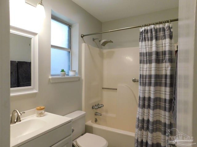 full bathroom with shower / tub combo, vanity, and toilet