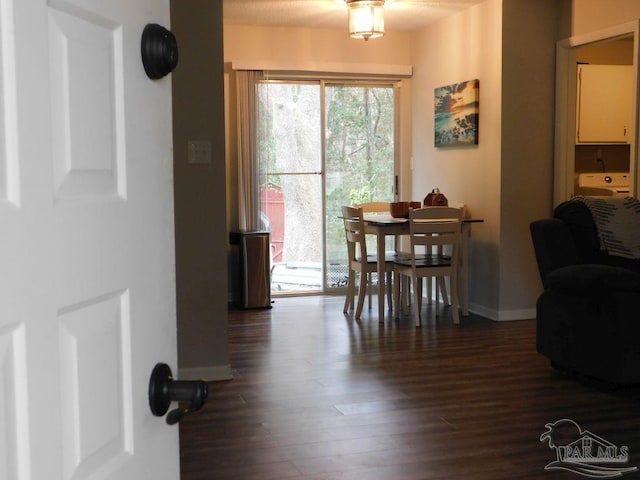 dining room with dark hardwood / wood-style flooring