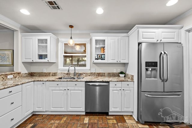 kitchen with white cabinetry, sink, pendant lighting, and appliances with stainless steel finishes