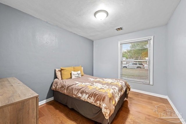 bedroom featuring hardwood / wood-style floors