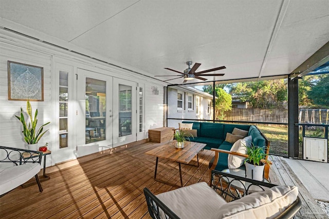 wooden deck featuring french doors, ceiling fan, and an outdoor living space