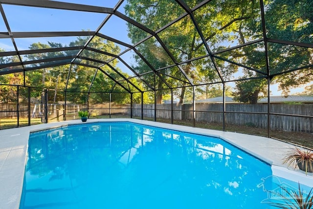 view of pool with a lanai