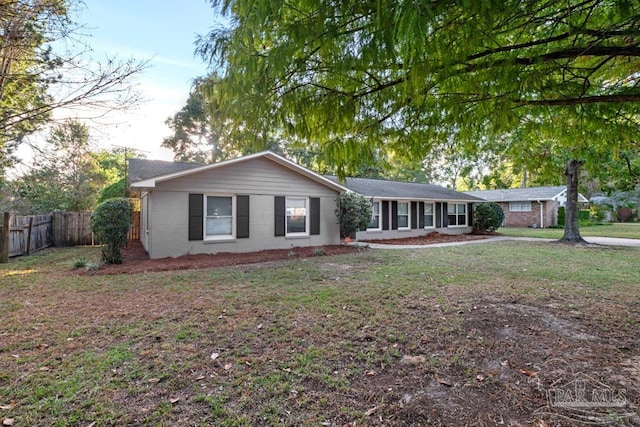 ranch-style home with a front yard