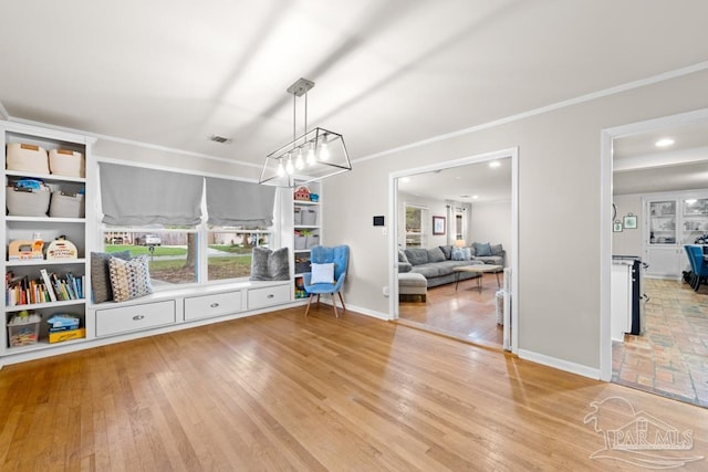 rec room featuring wood-type flooring and crown molding