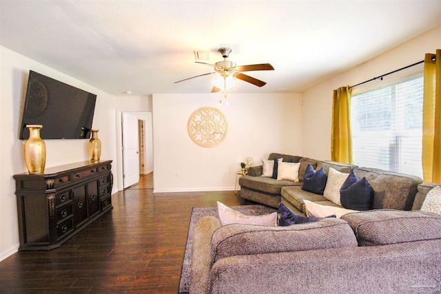 living room with ceiling fan and dark hardwood / wood-style flooring